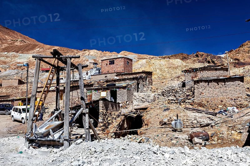 Weathered stone houses and huts on a mountainside with a clear sky, The silver mines of Potosi Bolivia