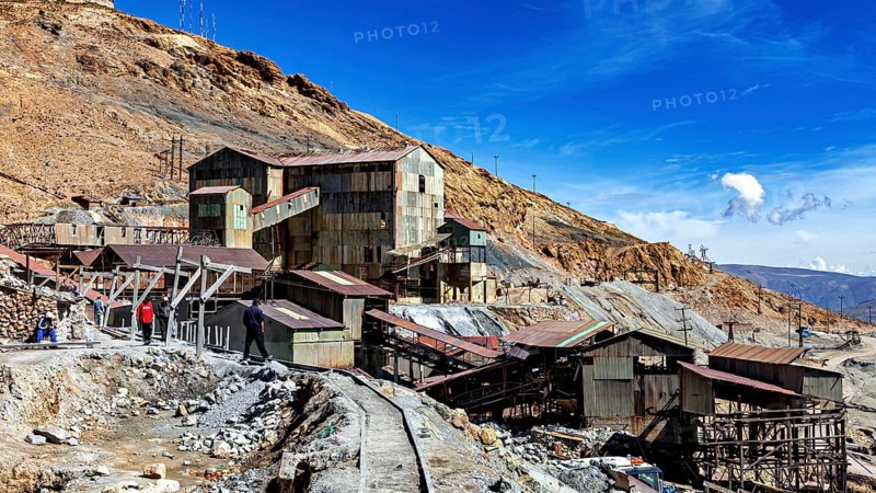 Historic industrial site on a mountainside under a clear blue sky, The silver mines of Potosi Bolivia