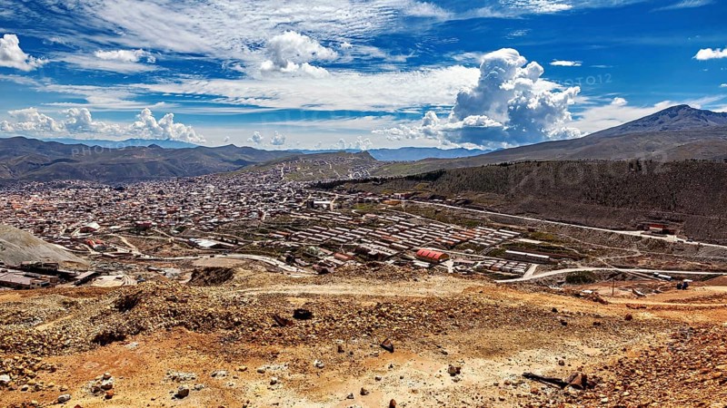 Large cityscape between hills under a dramatically cloudy sky with a wide view, view from Silver MountainCerro Rico to Potosi in Bolivia