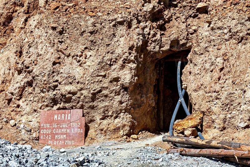 Mine entrance with shield and metallic beams in a rocky environment, The silver mines of Potosi Bolivia