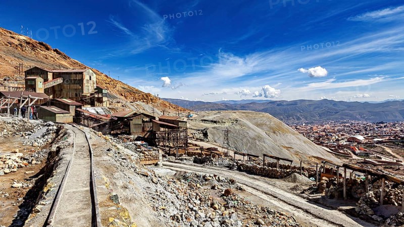 View of abandoned mine buildings and railway tracks in a hilly landscape, The silver mines of Potosi Bolivia