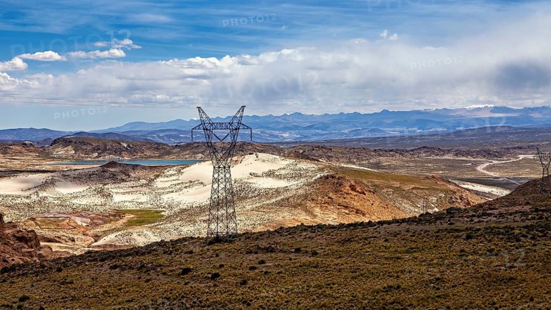 Power lines cross a vast, arid landscape, The landscape of the Altiplano in Bolivia