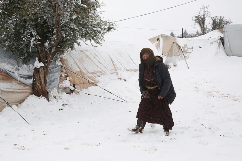 Displaced Syrian families and children living in refugee camps during harsh winter conditions, facing snow, cold weather, and difficult humanitarian circumstances. Aleppo, Syria January 01, 2022, Aleppo, Syria