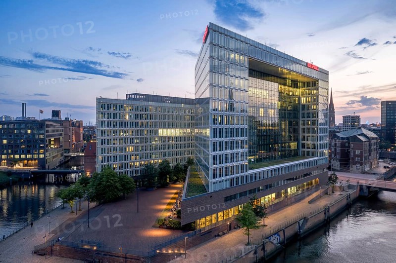 Aerial view of the Spiegel building at Ericusspitze in Hamburg's HafenCity in the Brooktorkai neighbourhood at blue hour, Hamburg, Germany