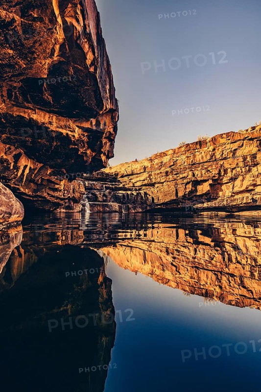 Bell Gorge waterfall, a body of water in north-west Australia in the Kimberley. Sunrise in the outback, Australia