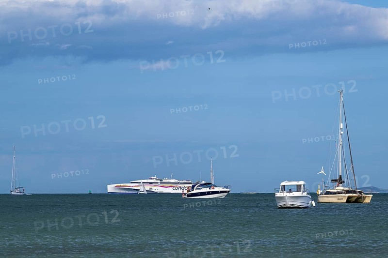 Boats on sea over Knoll Beach Studland, Poole, Dorset, England, United Kingdom