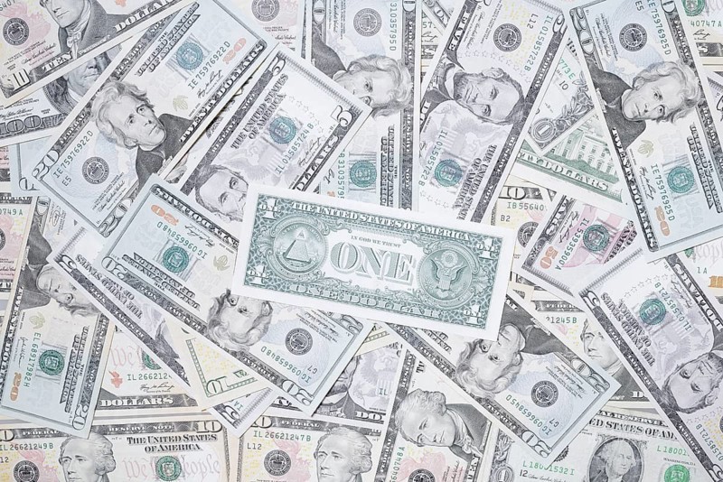 Various US dollar notes in a pile, banknotes