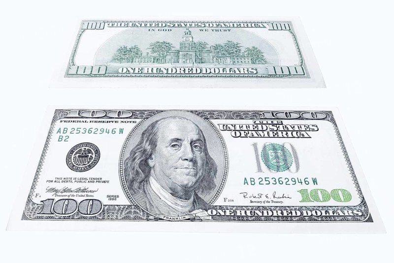 100 US dollar note, 100 dollar banknotes on white background