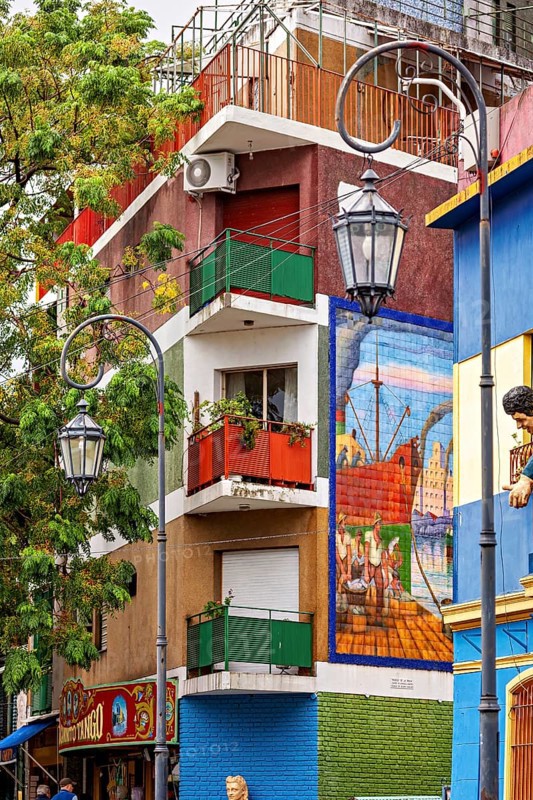 Colourful building with balconies and murals in a lively neighbourhood, the colourful city and tango district of La Bocca in Buenos Aires Argentina
