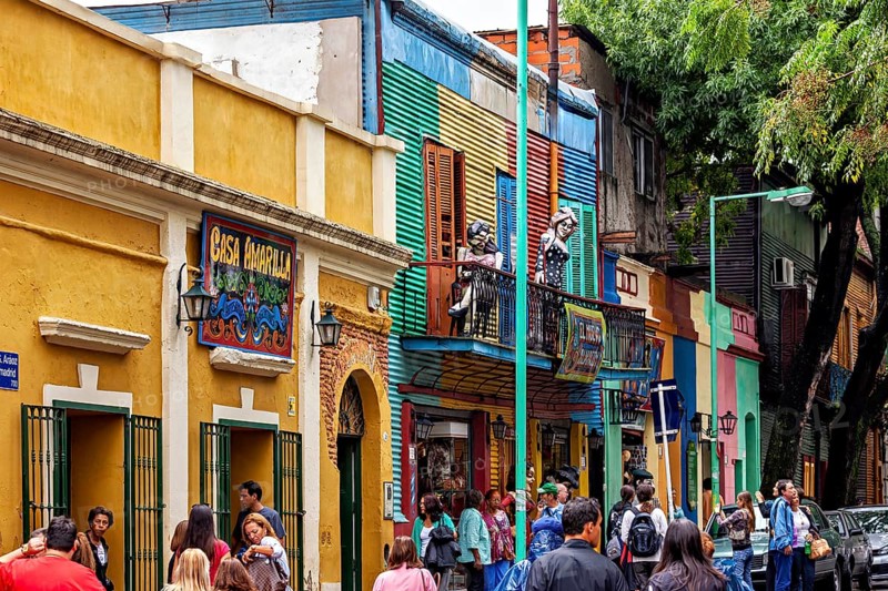 Lively street with colourful buildings and passers-by in La Boca, Buenos Aires, The colourful city and tango district La Bocca in Buenos Aires Argentina