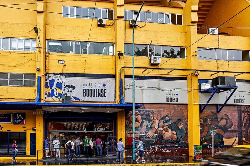 Entrance of the Museo Boquense with yellow and blue building, people in front of it, The football stadium of La Bocca of the Bocca Juniors in Buenos Aires Argentina
