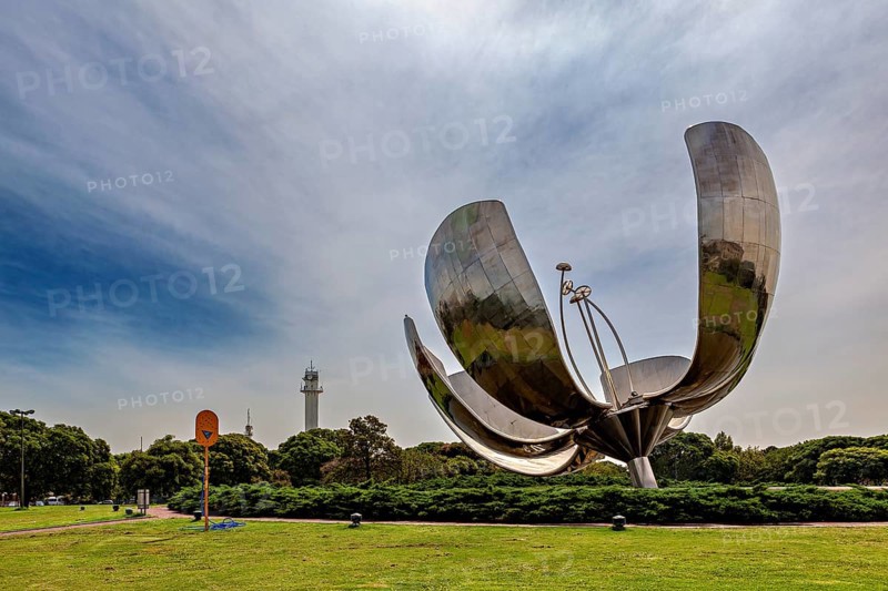Metal flower sculpture in a park under a cloudy sky in daylight, The lotus blossom in Buenos Aires Argentina