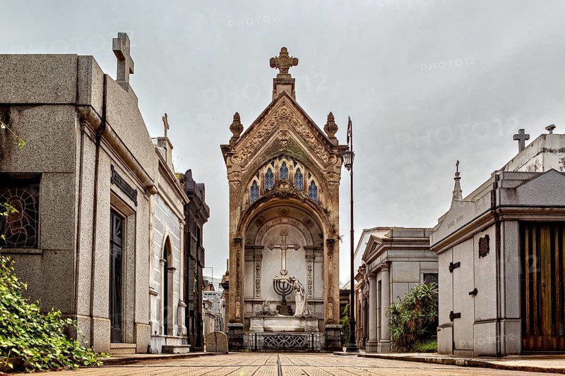 Large mausoleum with cross in a well-kept cemetery, La Recoleta cemetery in Buenos Aires Argentina