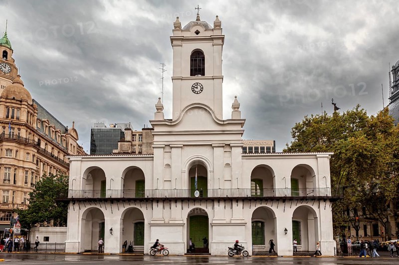 An old colonial style building with clock tower under a cloudy sky in the city, Historic buildings in the city of Buenos Aires Argentina