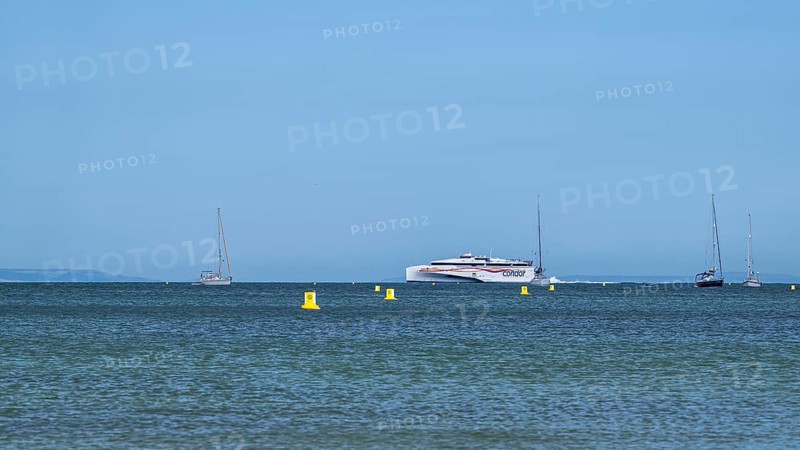 Boats on sea over Knoll Beach Studland, Poole, Dorset, England, United Kingdom