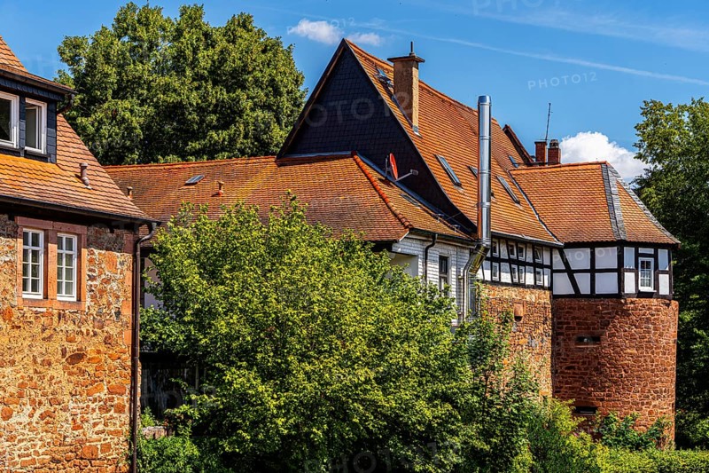 The old town centre with half-timbered houses, church towers and remains of the town wall in Büdingen, Hesse, Germany