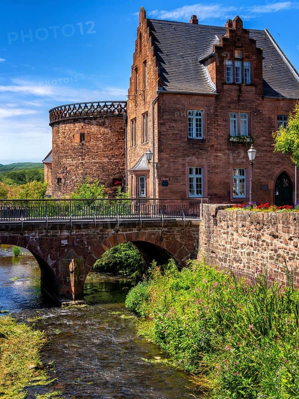 The old town centre with the town wall and the Seemenbach stream, Büdingen, Hesse, Germany