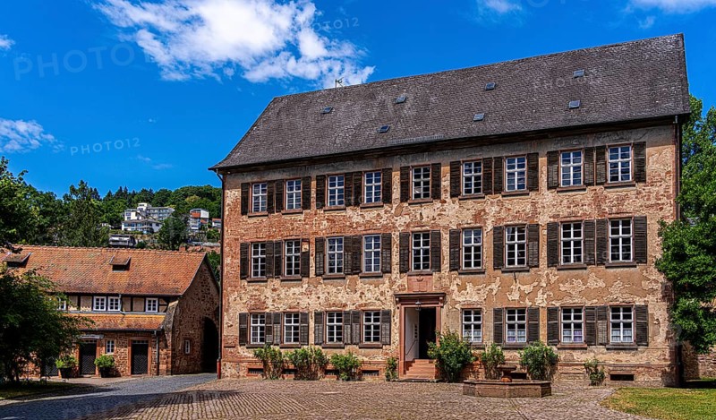 The old castle with Barbarossaplatz and the castle café in the old town centre of Büdingen, Hesse, Germany