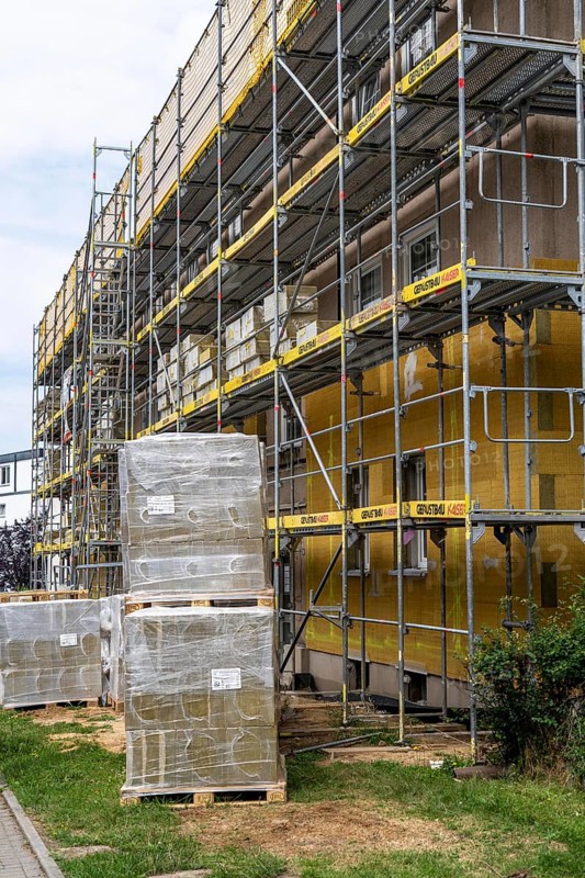 Energy refurbishment of an older residential building, thermal insulation with mineral wool insulation boards, mounted on the façade and then plastered, North Rhine-Westphalia, Germany