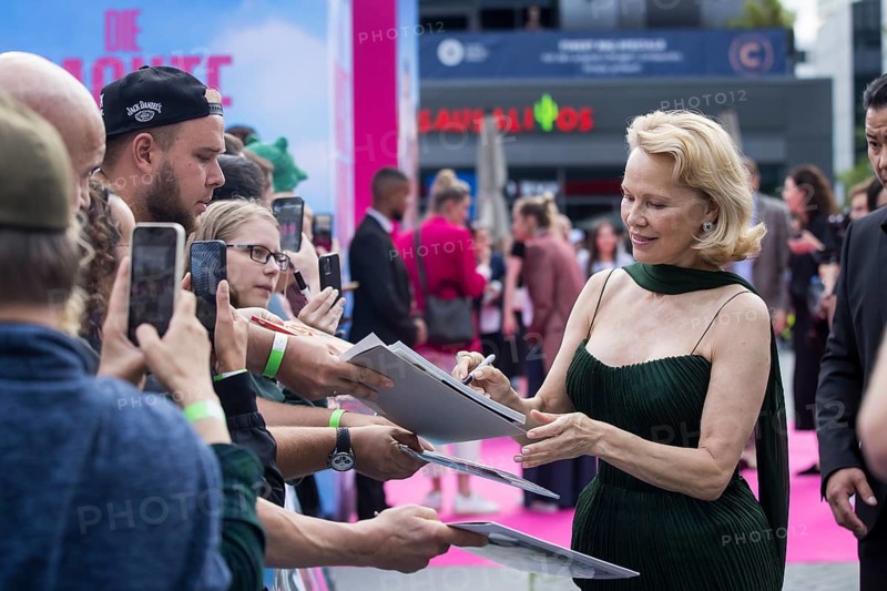 Pamela Anderson signs autographs in front of the film premiere of The Naked Gun at UCI Luxe East Side Gallery, Berlin, 24.07.2025
