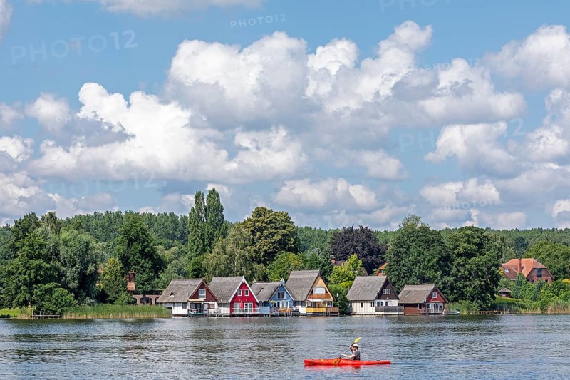 Boathouses, holiday homes on Lake Mirow, canoe, Mirow, Mecklenburg Lake District, Mecklenburg-Western Pomerania, Germany