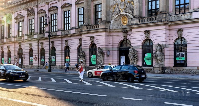 Road traffic and pedestrians on the carriageway in Berlin-Mitte, Unter den Linden, Berlin, Germany