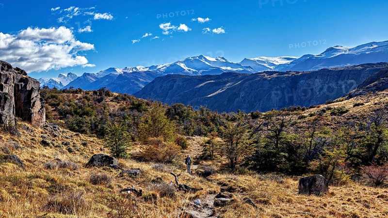 Picturesque mountain landscape with a hiker on a path under a clear sky, The landscape of Patagonia near El Chalten in Argentina