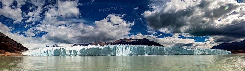 Idyllic panoramic view of a glacier and mountain range under a dynamic sky, The glacier of Perito Moreno in Argentina