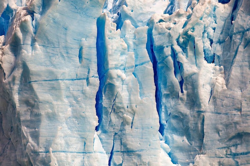 Close-up of a glacier with blue ice texture and visible cracks, The blue ice of the Perito Moreno glacier in Patagonia Argentina