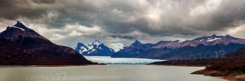 Vast, dramatic landscape in a panoramic format with glaciers and clouds over the horizon, The Perito Moreno glacier in Argentina