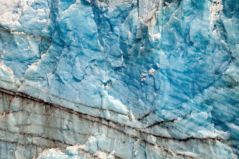 Close-up of blue ice surface with fine lines and natural patterns, The ice of the Perito Moreno glacier in Argentina