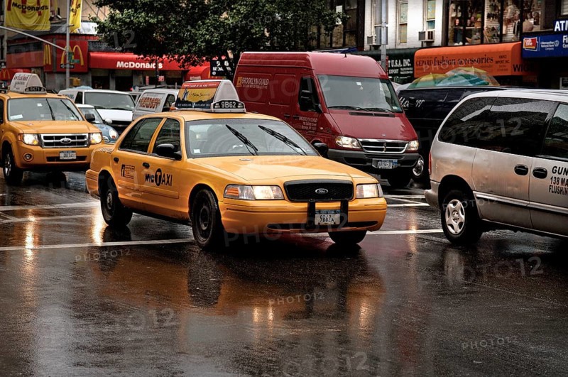 Yellow Caps, New York taxis in the rain, New York City, USA