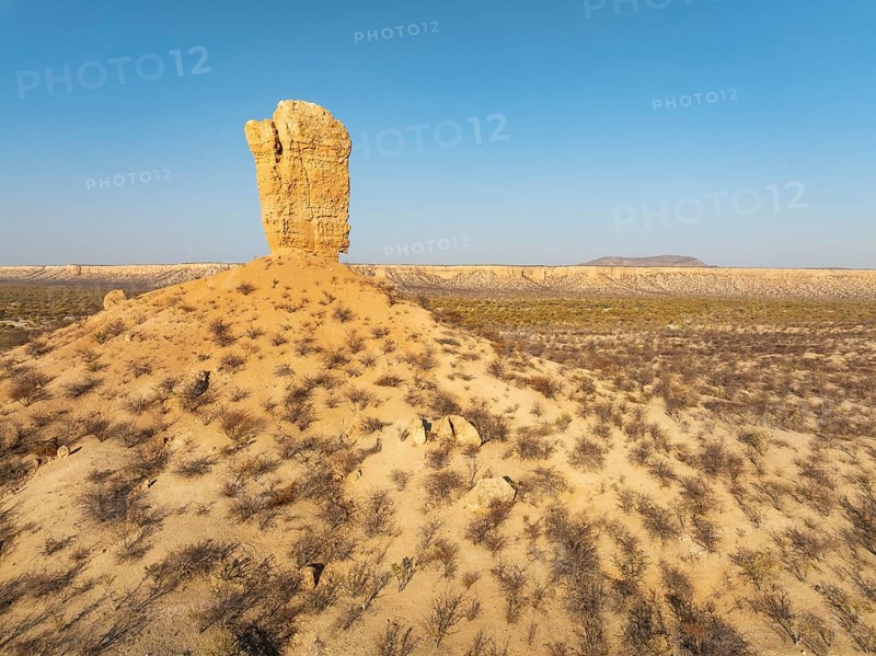 The Vingerklip (rock finger) and the Ugab Valley Terraces are surrounded by thornbush and mopane (Colophospermum mopane) savanna. Aerial view. Drone shot. Damaraland, Namibia