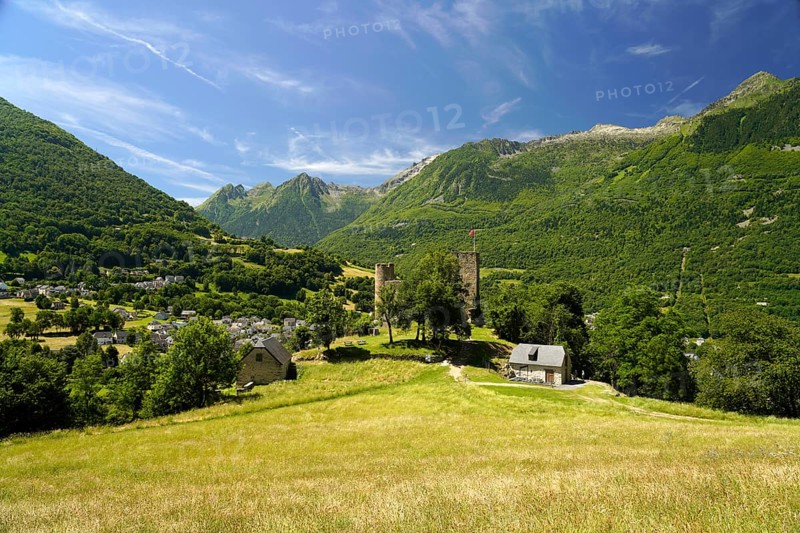 The ruins of the Château Sainte-Marie castle in Esterre and the mountain landscape near Luz-Saint-Sauveur, Pyrenees, France