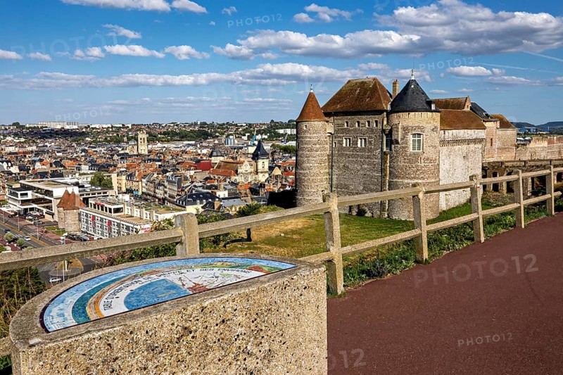 Castle with city view in the background, under a blue sky with white clouds, wide view of the city surroundings, Dieppe Castle in Normandy, France