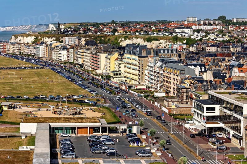Coastal town with promenade along residential buildings and view of cliffs and sea, The town of Dieppe in Normandy, France