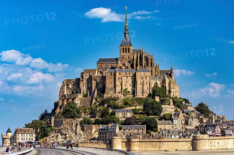 The historic monastery of Mont Saint-Michel against a bright blue sky, Mont Saint Michel in Normandy, France