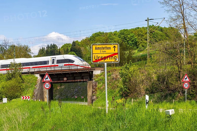 InterCityExpress ICE en route on the Swabian Alb near Lonsee. Landscape with railway bridge near Urspring on the Filstalline railway line in spring. Lonsee, Baden-Württemberg, Germany
