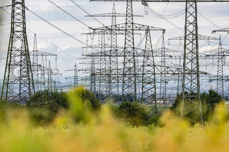Many high-voltage power lines and lattice towers in the district of Ludwigsburg near Besigheim, Baden-Württemberg, Germany