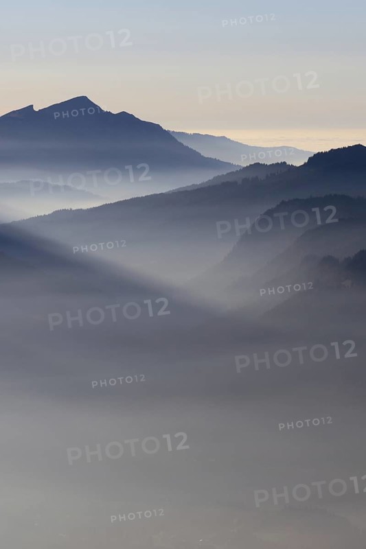 Mountain silhouettes... Alpine peaks and mountain ranges in the Bavarian Alps, light fog rises from the valleys, which creates an idyllic atmosphere in the light of the low sun, romantic view from Oberstdorf towards Kleinwalsertal, local nature, Bavaria, Allgäu, Allgäu Alps, Bavarian, Germany, Western Europe