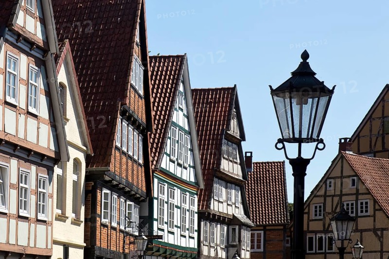 Street with half-timbered houses and historic street lamp in the old town centre, Celle, Lower Saxony, Germany