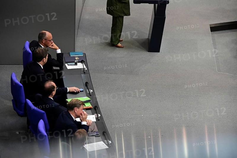 Federal Chancellor Friedrich Merz (CDU) and parts of his cabinet sit on the government bench, whilec, co-chair of the Greens parliamentary group, responds to the Federal Chancellor's government statement