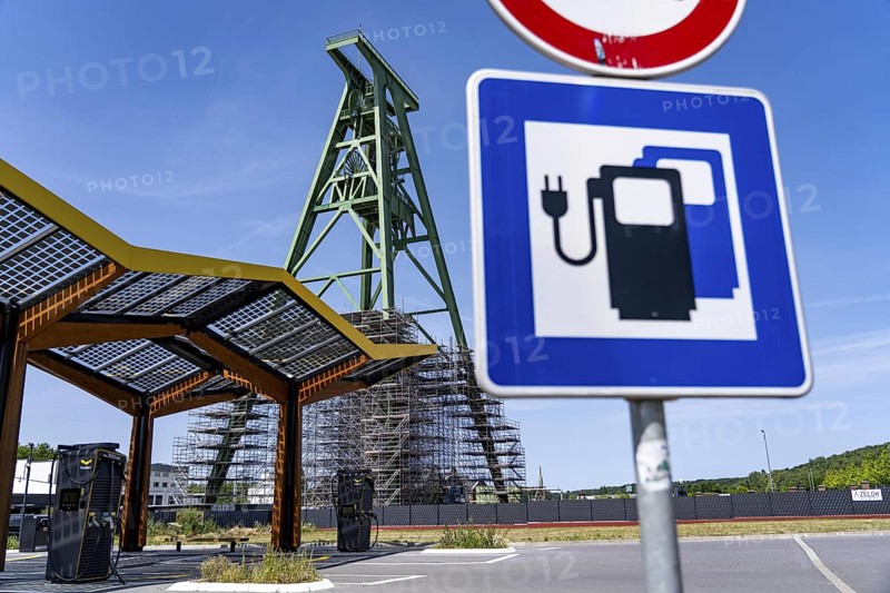 Electric charging station on the site of the former Lohberg colliery in Dinslaken, operated by Fastned, uses electricity from wind power and solar energy, fast-charging columns, with its own solar roof, Lohberg colliery headframe, North Rhine-Westphalia, Germany
