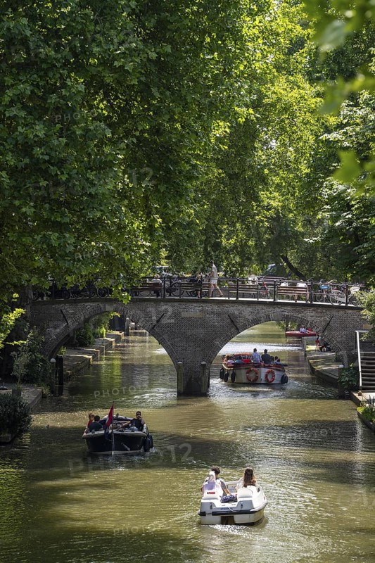 The old town centre of Utrecht, Oudegracht, around 2 km long with many old houses, shops, restaurants directly on the canal, many bridges, boat traffic of all kinds, Netherlands