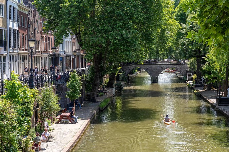 The old town centre of Utrecht, Oudegracht, around 2 km long with many old houses, shops, restaurants directly on the canal, many bridges, boat traffic of all kinds, Netherlands
