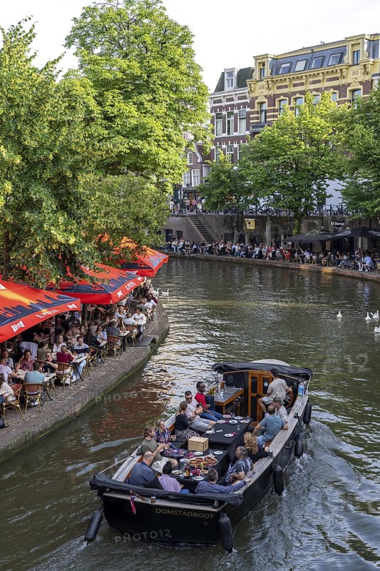 The old town centre of Utrecht, Oudegracht, around 2 km long with many old houses, shops, restaurants directly on the canal, many bridges, boat traffic of all kinds, canal cruise, Netherlands