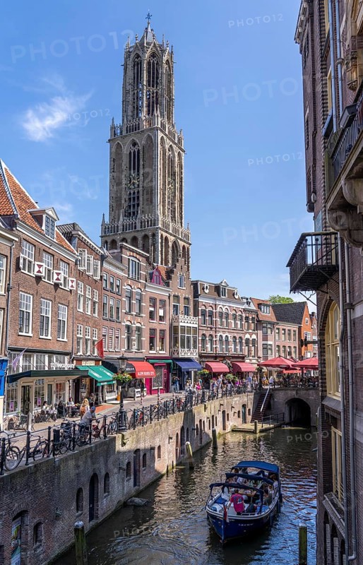 The old town centre of Utrecht, Oudegracht, around 2 km long with many old houses, cathedral tower, highest church tower in the Netherlands, newly renovated, shops, restaurants directly on the canal, many bridges, boat traffic of all kinds, canal tour, Netherlands