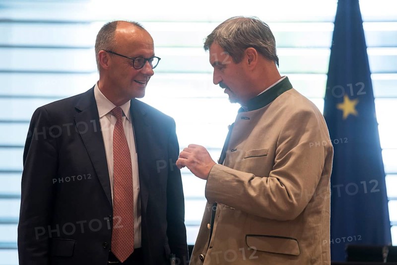 Federal Chancellor Friedrich Merz (l, CDU) and Markus Söder (CSU Chairman and Minister President of Bavaria) in front of the meeting between Federal Chancellor Friedrich Merz and the heads of government of the federal states in the International Conference Hall of the Federal Chancellery, Berlin, 18 June 2025