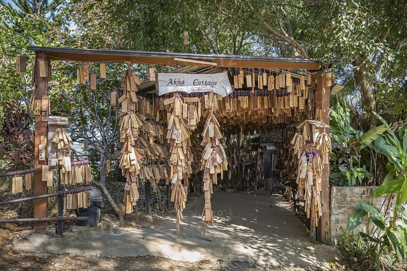 Plaques with messages from prrevious customers hang at entrance to the Akha Cottage restaurant and coffee shop in Chiang Rai, Thailand