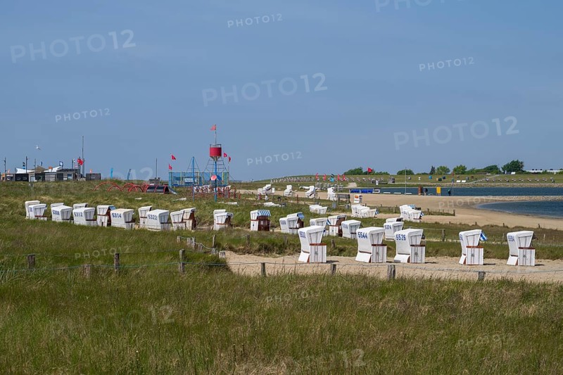 Beach chairs on the family lagoon, Perlebucht, Büsum, North Sea, Schleswig-Holstein, Germany